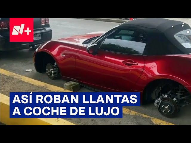 ⁣Así quita pareja de ladrones tres llantas a un auto de lujo - N+