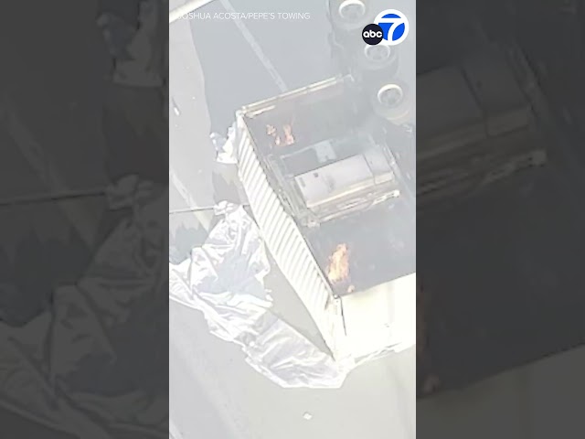 ⁣Semi-truck carrying lithium-ion batteries overturns, sparks fire in San Pedro