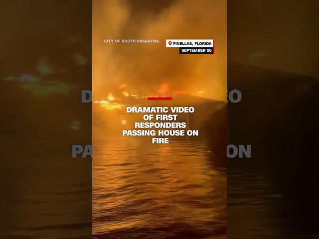 ⁣Dramatic footage of first responders passing house on fire