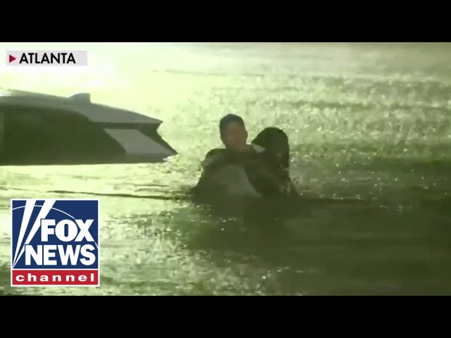 ⁣FOX Weather reporter rescues woman from car as floodwaters rise