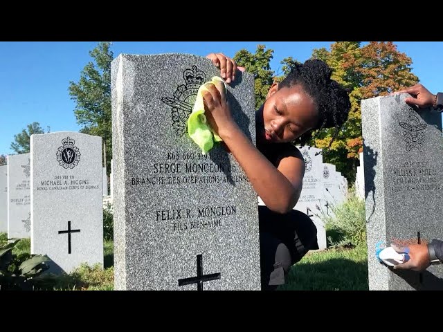 ⁣Volunteers help clean headstones of fallen Canadian soldiers in preparation for Remembrance Day