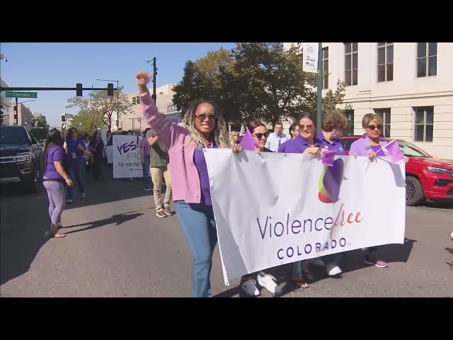 ⁣Dozens take to the streets to recognize Domestic Violence Awareness Month