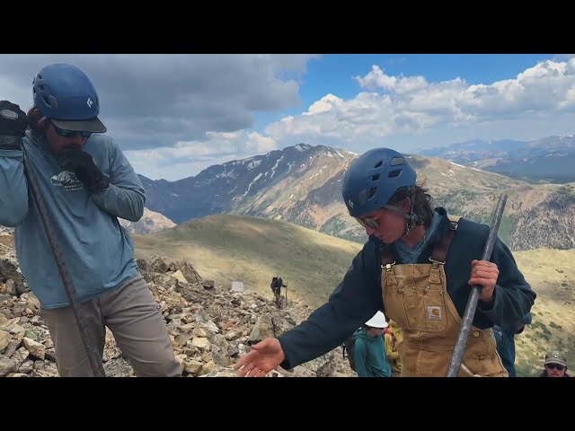 ⁣Young workers do heavy work high on Colorado's tallest mountains