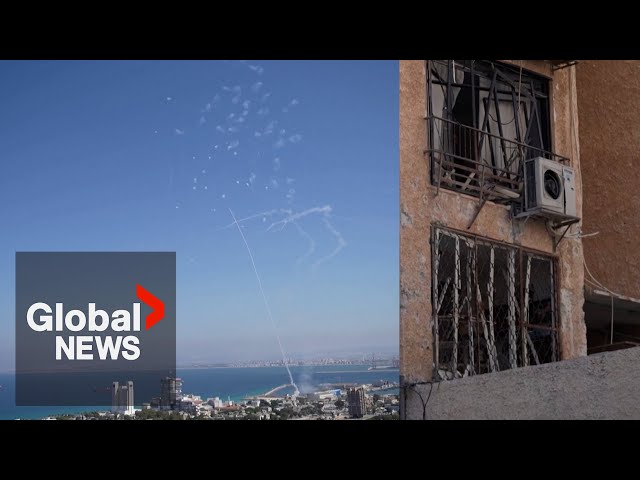 ⁣Hezbollah launch over 100 rockets at northern Israel, damaging building in Haifa