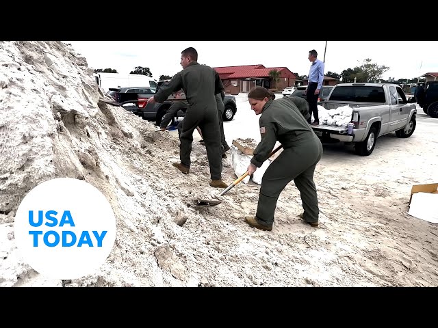 ⁣Airmen fill sandbags to prepare for Hurricane Milton in Tampa, Florida | USA TODAY