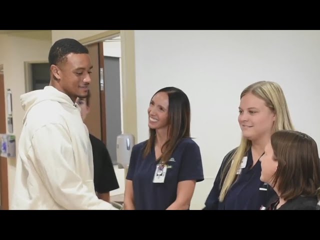 ⁣Broncos player visits UCHealth to brighten patients' days