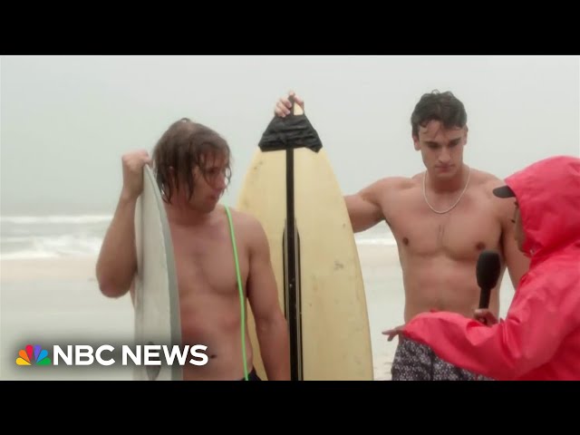 ⁣‘Just trying to enjoy the surf’: Surfers catch waves as Milton approaches