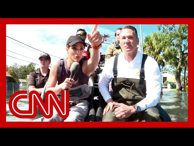 ⁣CNN tours flooded neighborhood on an airboat rescuing survivors