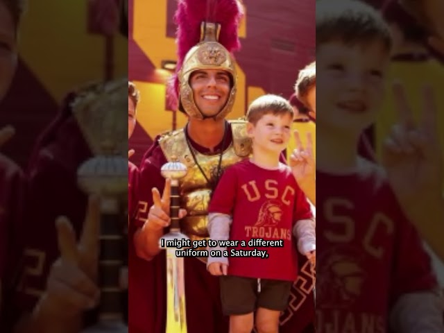 ⁣USC'S drum major Sam Perez marches to the top