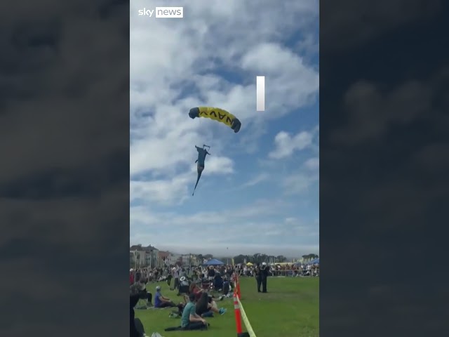 ⁣Moment parachutist lands on spectators