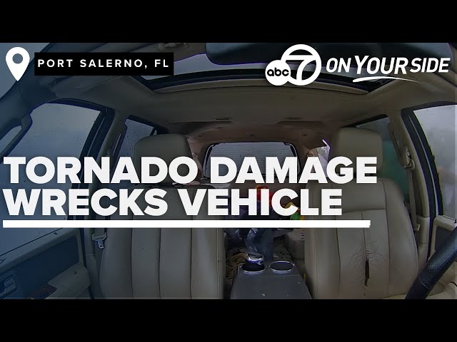 ⁣Inside car perspective shows Florida tornado debris severely damage vehicle