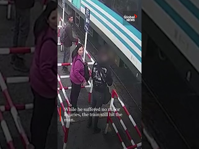 ⁣Man distracted on his phone just avoids being hit by a train 