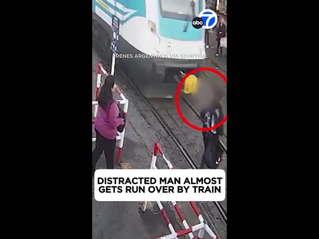 ⁣Man Almost Gets Run Over by Train While Staring at Phone