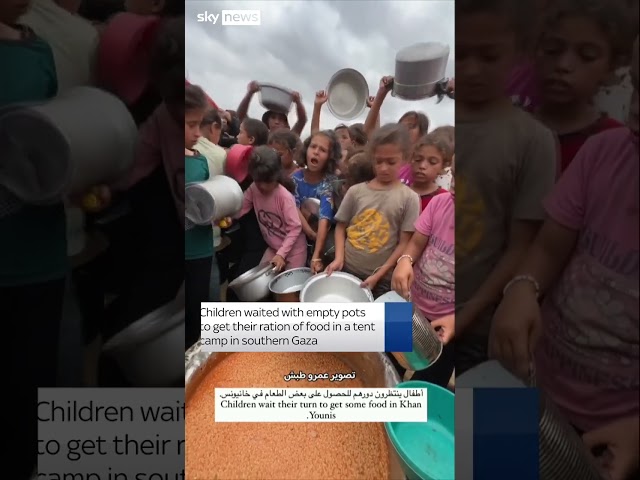 ⁣Children gather for food rations in Gaza camp