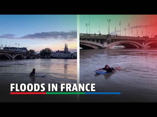 ⁣Man paddles on surfboard through floodwaters in France | ABS-CBN News