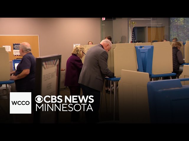 ⁣Tim Walz casts ballot early with son Gus