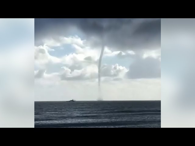 ⁣Towering waterspout swirls off Florida's coast | WATCH