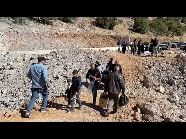 ⁣Civilians flee through damaged Lebanon-Syria border crossing