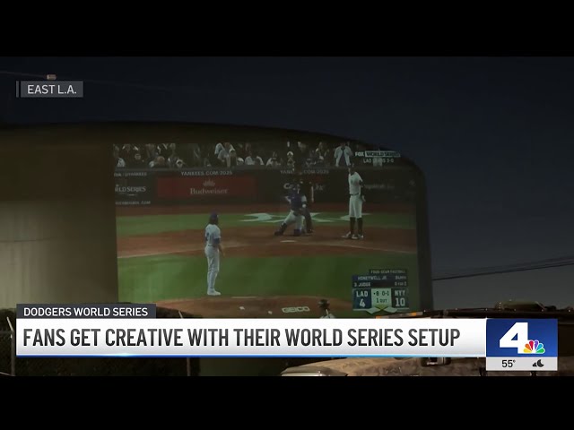 ⁣Dodger fans in East LA use water tank to watch World Series