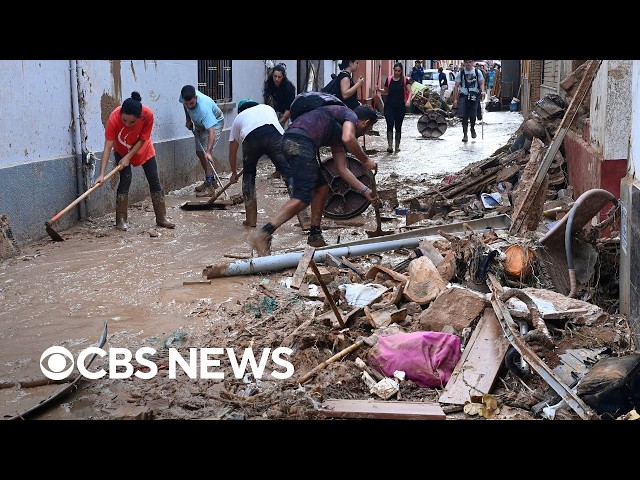 Footage shows Spain residents trekking through muddy streets after deadly floods