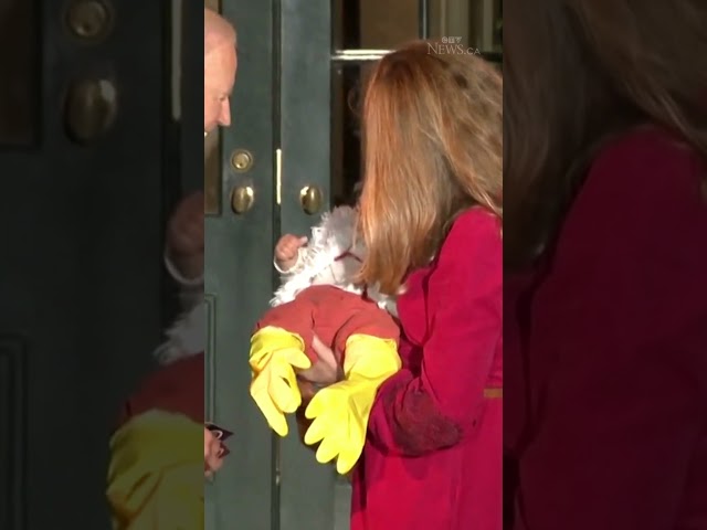 ⁣Biden jokingly bites baby in chicken costume