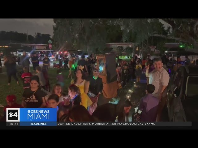 ⁣Massive line of trick-or-treaters forms outside CBS News Miami's Lauren Pastrana's home