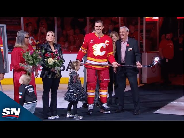 ⁣Flames Present Mikael Backlund With Silver Stick In Honour Of 1,000 Games