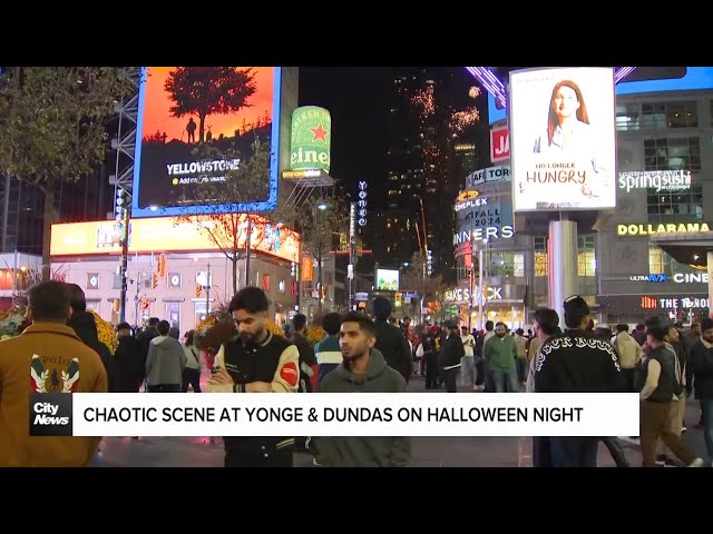 ⁣Chaotic scene at Yonge and Dundas as fireworks and vehicles flood the intersection