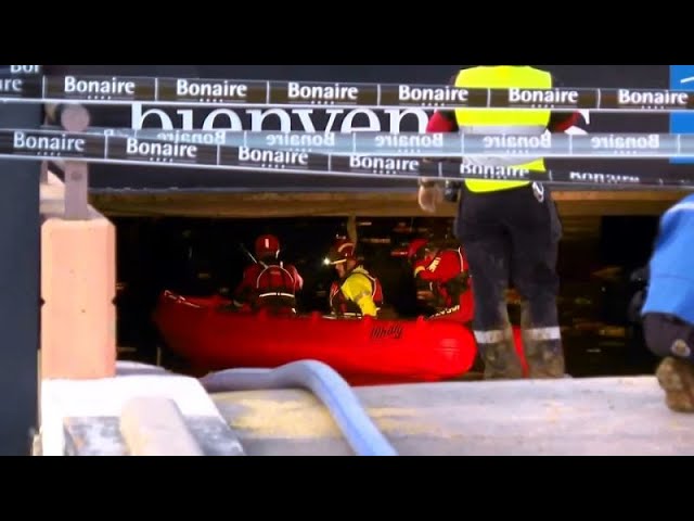 ⁣Rescue teams drain underground garages in search for missing people in Valencia