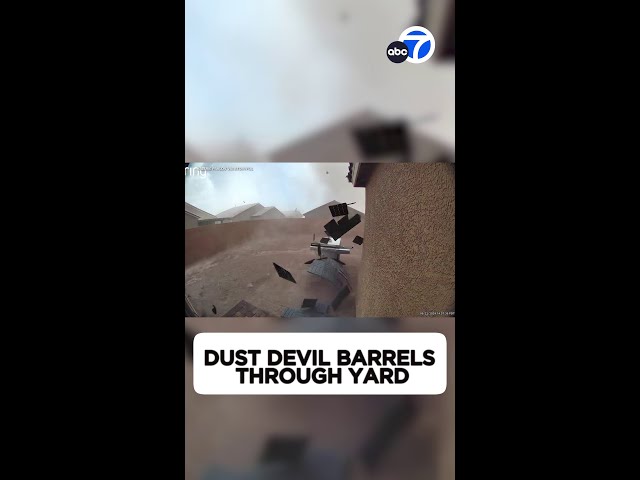 ⁣Intense dust devil barrels through yard in Las Vegas