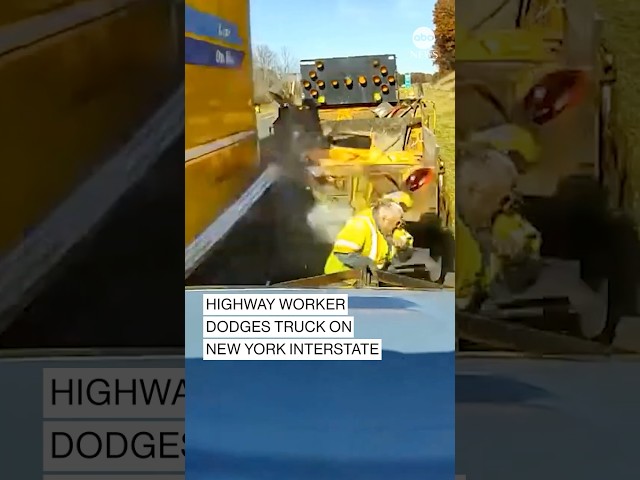 ⁣Highway worker dodges truck on New York interstate