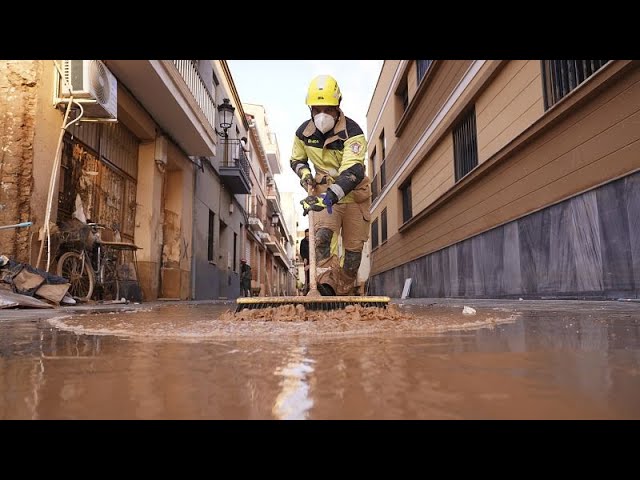 ⁣Shops start to reopen in Valencia after catastrophic flooding kills 219 in Spain