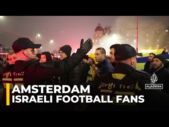 ⁣Israeli football fans clash with protesters in Amsterdam