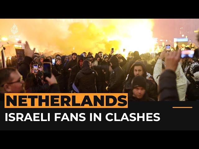 ⁣Israeli football fans clash with protesters in Amsterdam