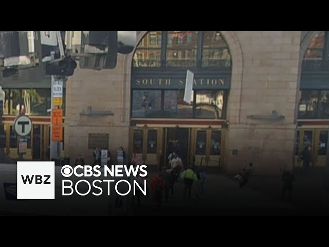 ⁣Falling panel narrowly misses people in front South Station