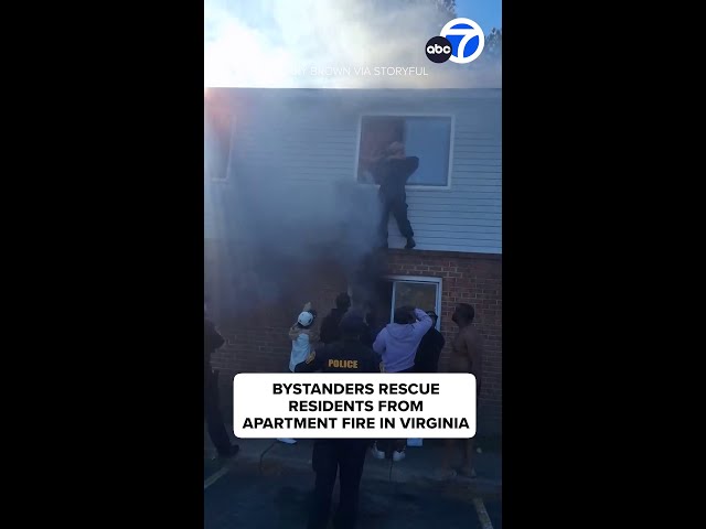 ⁣Bystanders rescue residents from burning apartment building