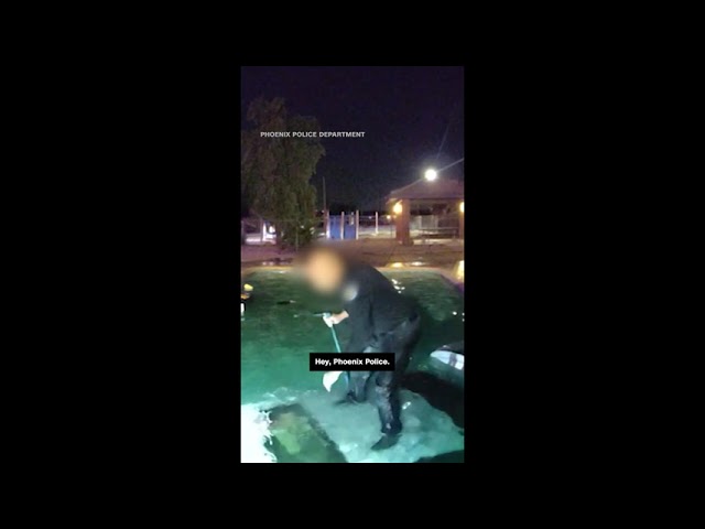 ⁣Officer rushes to save man after he drove car into pool