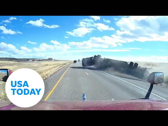 ⁣Dramatic video: Semi-truck overturns on interstate | USA TODAY