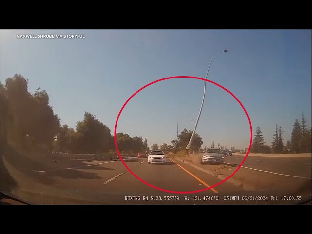 ⁣Streetlight snaps off, flies through air during crash on NorCal highway