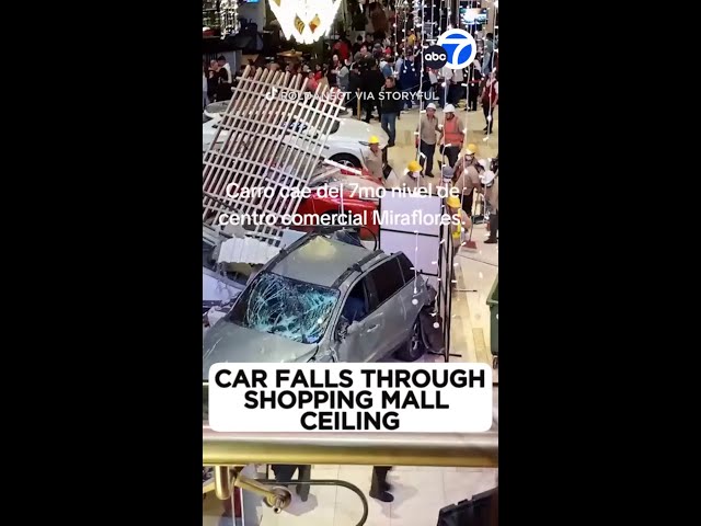 ⁣Car falls through shopping center