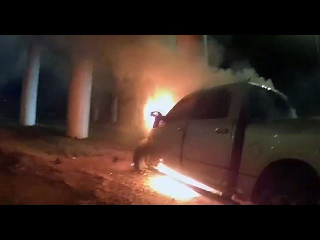 ⁣Dramatic video shows officers save driver from burning truck after brakes fail