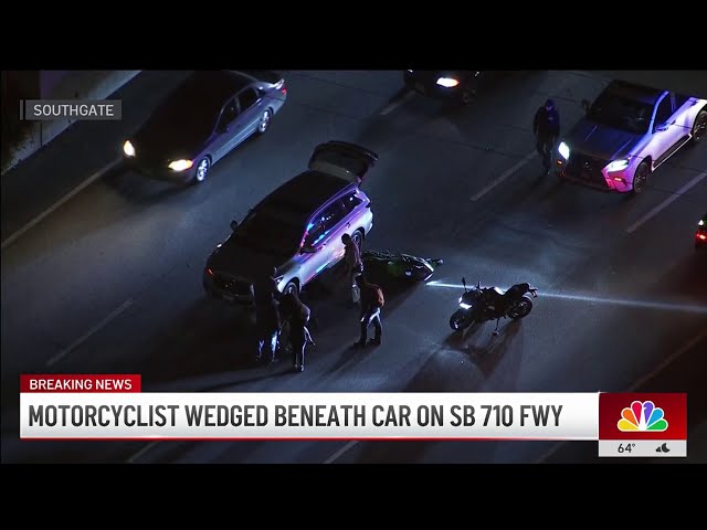 ⁣Motorcyclist wedged beneath car on 710 Freeway in South Gate