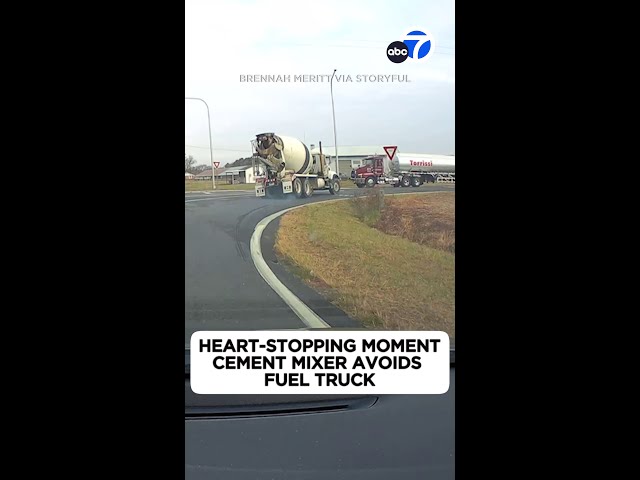 ⁣Heart-stopping moment cement mixer avoids fuel truck