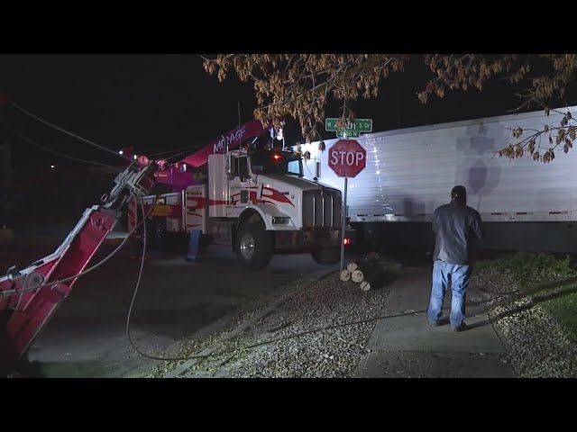 ⁣3 in hospital after a semi rolled over into neighborhood