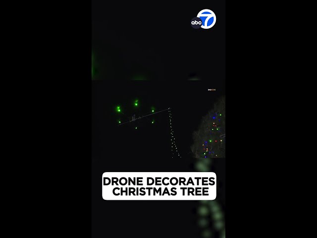 ⁣Drone decorates tall Christmas tree in SoCal city