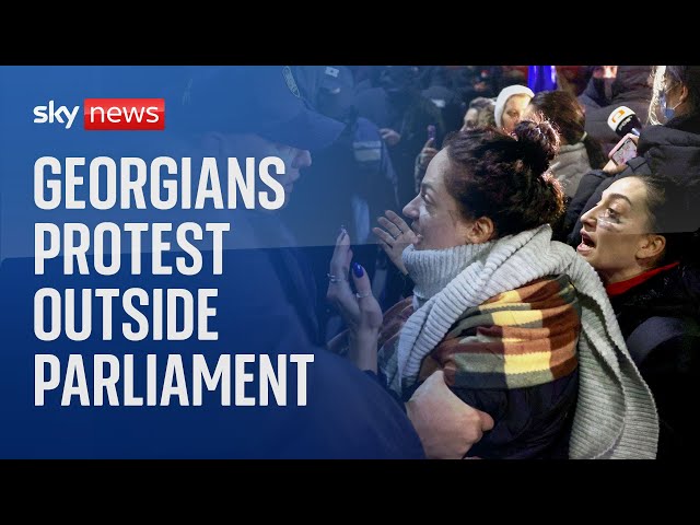 ⁣Georgians protest outside Parliament