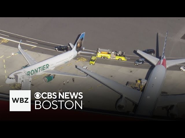 ⁣Frontier, American planes clip wings while at Logan Airport gate in Boston