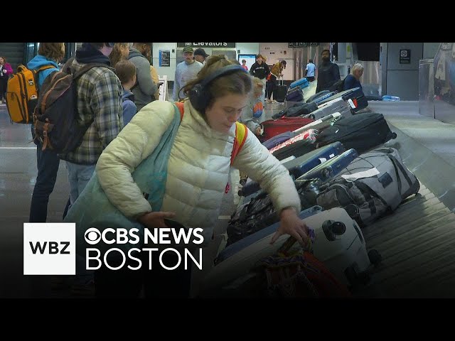 ⁣Travelers arrive at Logan Airport hoping to avoid Thanksgiving storm