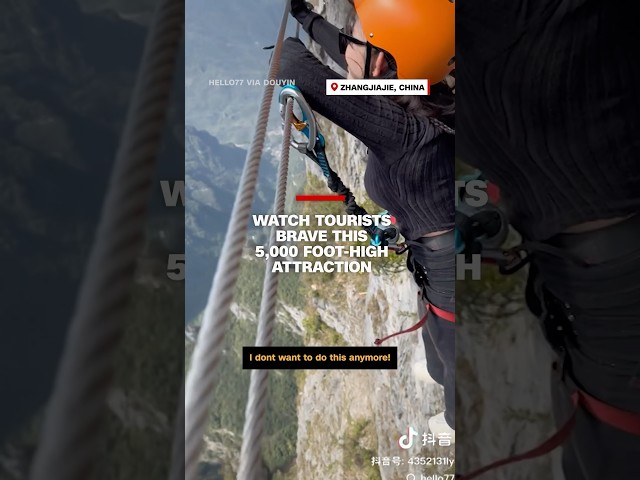 ⁣Watch tourists brave this 5,000 foot-high attraction