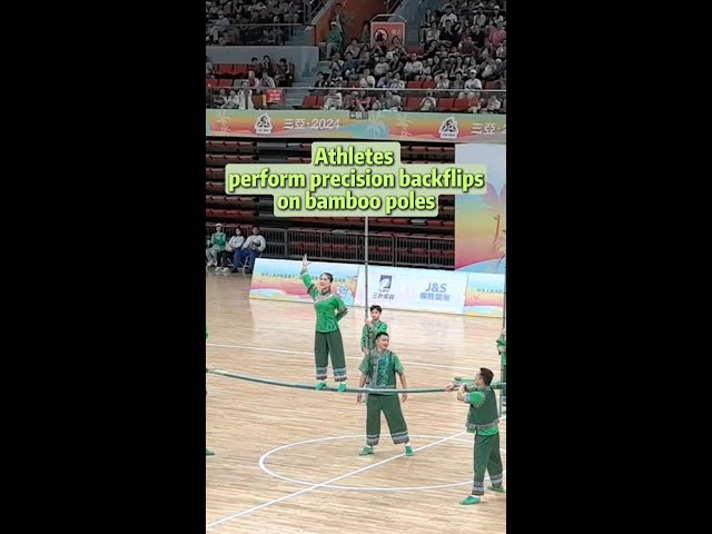 ⁣Stunning! Athletes perform precision backflips on bamboo pole